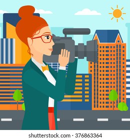 Camerawoman with video camera.