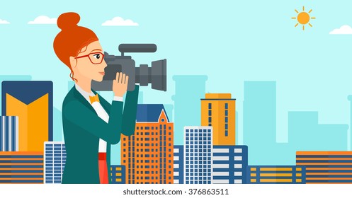 Camerawoman with video camera.