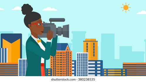 Camerawoman with video camera.