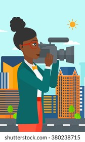 Camerawoman with video camera.