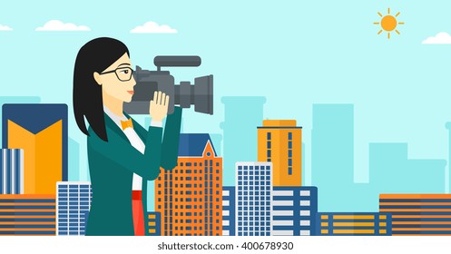 Camerawoman with video camera.