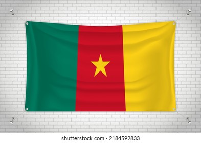 Cameroon flag hanging on brick wall. 3D drawing. Flag attached to the wall. Neatly drawing in groups on separate layers for easy editing.