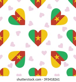 Cameroon flag independence day seamless pattern. Patriotic country flag background. Cameroon flag in the shape of heart. Vector seamless pattern.