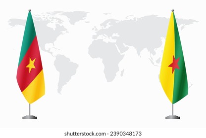 Cameroon and French Guiana flags for official meeting against background of world map.