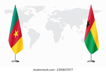 Cameroon and Guinea Bissau flags for official meeting against background of world map.