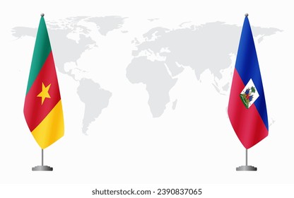 Cameroon and Haiti flags for official meeting against background of world map.