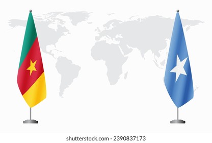 Cameroon and Somalia flags for official meeting against background of world map.