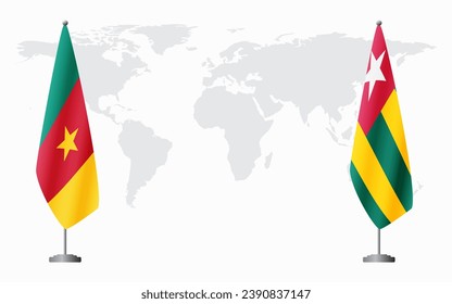 Cameroon and Togo flags for official meeting against background of world map.