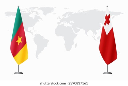 Cameroon and Tonga flags for official meeting against background of world map.