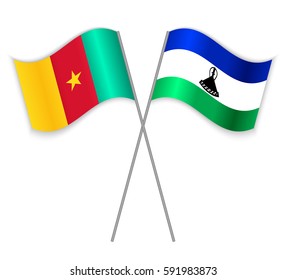 Cameroonian and Basotho crossed flags. Cameroon combined with Lesotho isolated on white. Language learning, international business or travel concept.