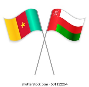 Cameroonian and Omani crossed flags. Cameroon combined with Oman isolated on white. Language learning, international business or travel concept.