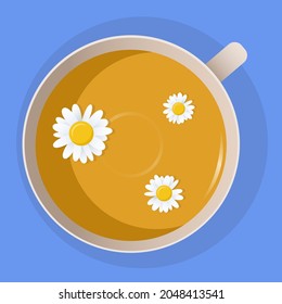 Camomile tea in a cup with flowers on top. 