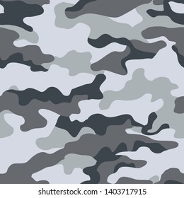 Camouflage seamless pattern.Military,hunting texture.Winter.Gray and dark spots on a light background.Print on fabric on paper.Vector design