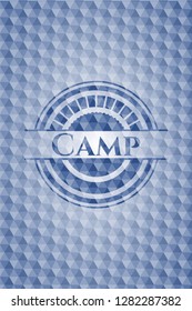 Camp blue emblem with geometric background.