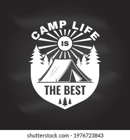 Camp life is the best. Vector chalkboard Concept for shirt or logo, print, stamp or tee. Vintage typography design with Camper tent and forest silhouette. Camping quote.