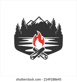 Camp logo with campfire. Stay wild and free. Vector illustration. Camping and outdoor adventure retro logo, badge, sticker, stamp for your design