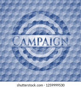 Campaign blue emblem with geometric pattern background.