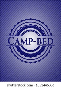 Camp-bed emblem with jean background