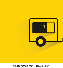 camper trailer with shadow on yellow background