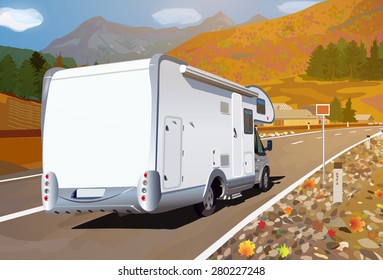 Camper traveling on mountains road at autumn season.