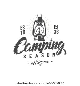 Camping badge with  lantern. Lettering. Typography. Retro design. Vector illustration.