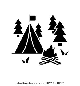 Camping black glyph icon. Nature tourism, outdoor recreation silhouette symbol on white space. Inexpensive vacation, overnight stay in forest. Campfire and tent in woods vector isolated illustration