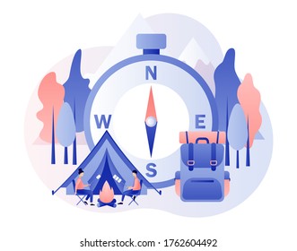 Camping concept. Nature tourism. Tiny people in summer camp with big compass, travel backpack, tent, campfire, mountains and forest. Modern flat cartoon style. Vector illustration on white background