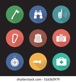 Camping equipment flat design long shadow icons set. Tourist gear. Axe, binoculars, walkie-talkie, carabiner, backpack, photo camera, compass, flashlight, first aid kit. Vector silhouette illustration
