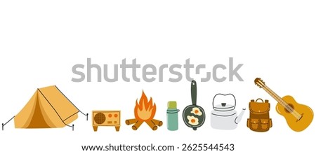Camping essentials gathered around a cozy fire in the great outdoors