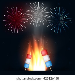  Camping Fire With American Flag Marshmallows Colors On Stick And Fireworks.4th Of July Background.
