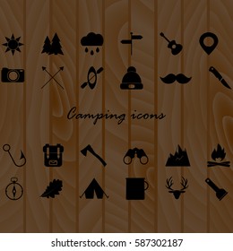 Camping icons set on wood texture background. Vector illustration. Set Of 24 Editable Camping Icons. Can Be Used For Web, Mobile, UI And Infographic Design.