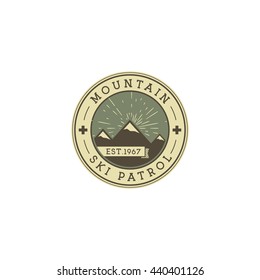 Camping Label. Vintage Mountain ski patrol patch. Outdoor adventure logo design. Travel retro and hipster color insignia. Adventure badge design. Wilderness emblem and stamp. Vector