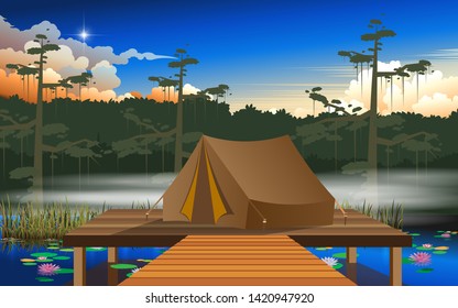 camping tent on the wooden floor at the swamp in the jungle
