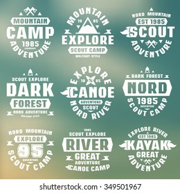 Camping and tourism badges. Graphic design for t-shirt. White print on blurred background