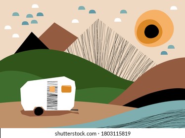 Camping trailer on the river bank in the mountains