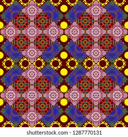 It can be used in the design of textiles, in the printing industry. Kaleidoscopic seamless pattern in blue, yellow and red colors. Vector illustration.