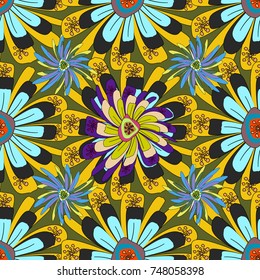 Can be used in dressing clothes, textiles, household items. Embroidery colorful trend floral seamless pattern in blue, yellow and green colors.