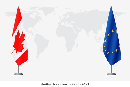 Canada and European Union flags for official meeting against background of world map.
