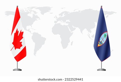 Canada and Guam flags for official meeting against background of world map.