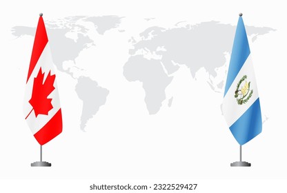 Canada and Guatemala flags for official meeting against background of world map.