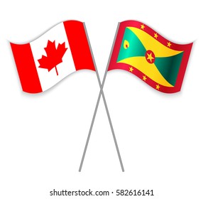 Canadian and Grenadian crossed flags. Canada combined with Grenada isolated on white. Language learning, international business or travel concept.