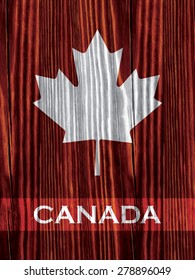 Canadian maple leaf on wooden background