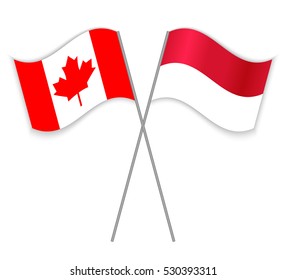 Canadian and Monegasque crossed flags. Canada combined with Monaco isolated on white. Language learning, international business or travel concept.