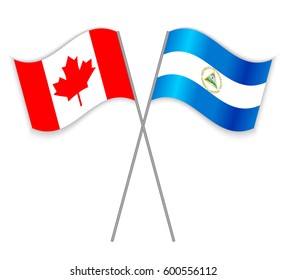 Canadian and Nicaraguan crossed flags. Canada combined with Nicaragua isolated on white. Language learning, international business or travel concept.