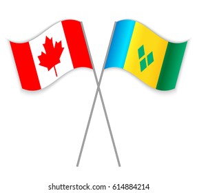 Canadian and Vincentian crossed flags. Canada combined with Saint Vincent and the Grenadines isolated on white. Language learning, international business or travel concept.