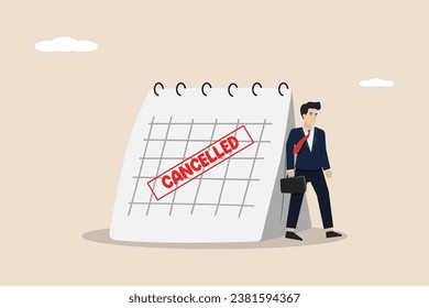 Canceled business trip, postponed or cancelled meeting, sad businessman standing with calendar with Red Canceled stamp.