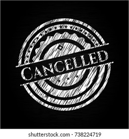 Cancelled chalkboard emblem written on a blackboard