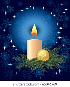 Candle and Christmas tree ball on a pine branch