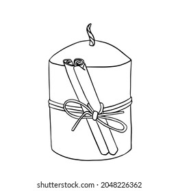 The candle is decorated with a cinnamon stick.