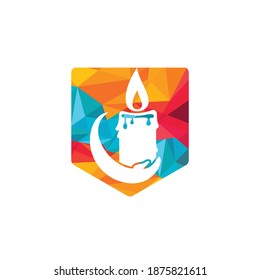 Candle light care vector logo design. Candle and hand icon design.